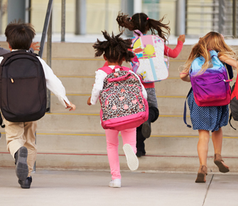 students with backpack running