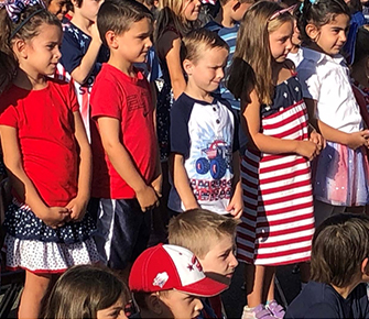 Students wearing red, white, and blue