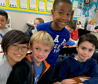 Four male students smiling