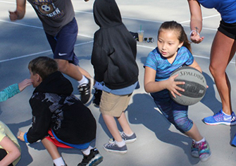 student playing basketball