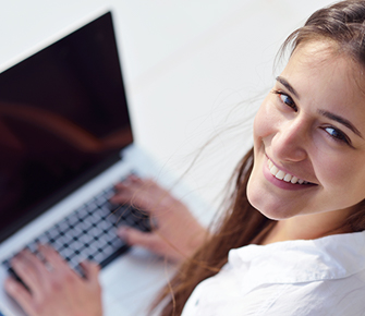 a female working on a laptop