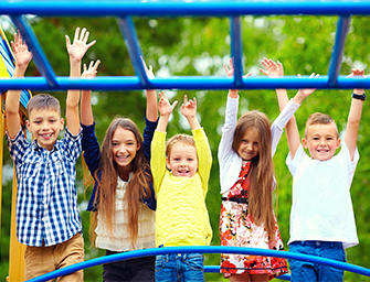 5 studens on monkey bars