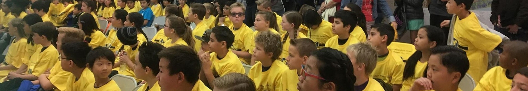 students in yellow shirts